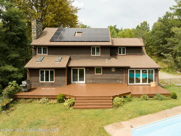 aerial view of a house with a yard