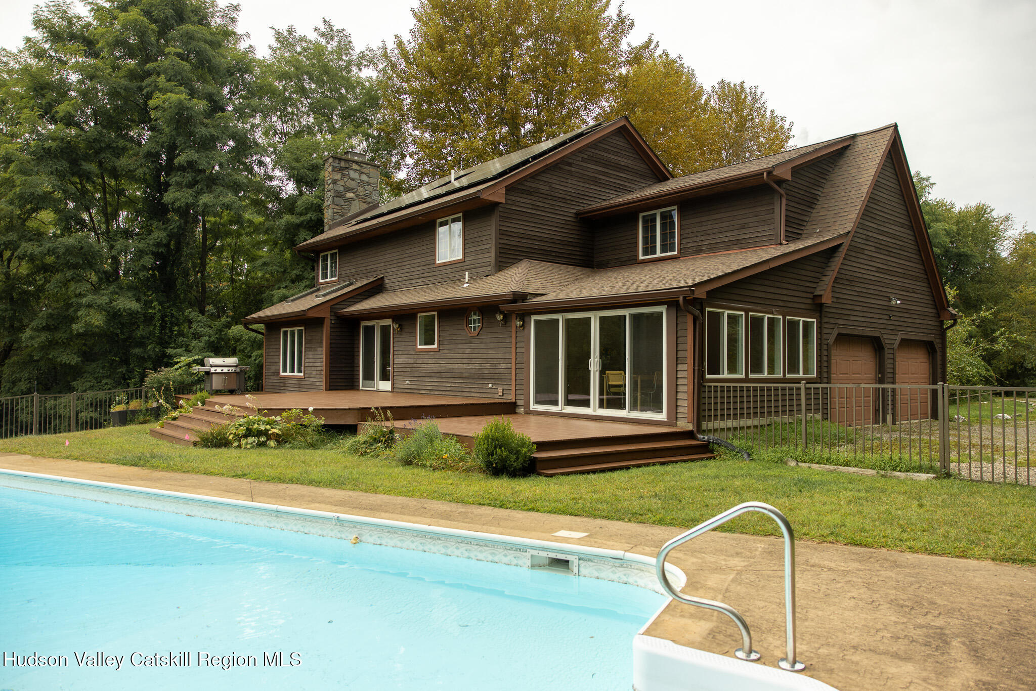 46 Webster Coon Road Red Hook, NY 12571 - Photo 4 of 27 a front view of a house with a yard table and chairs