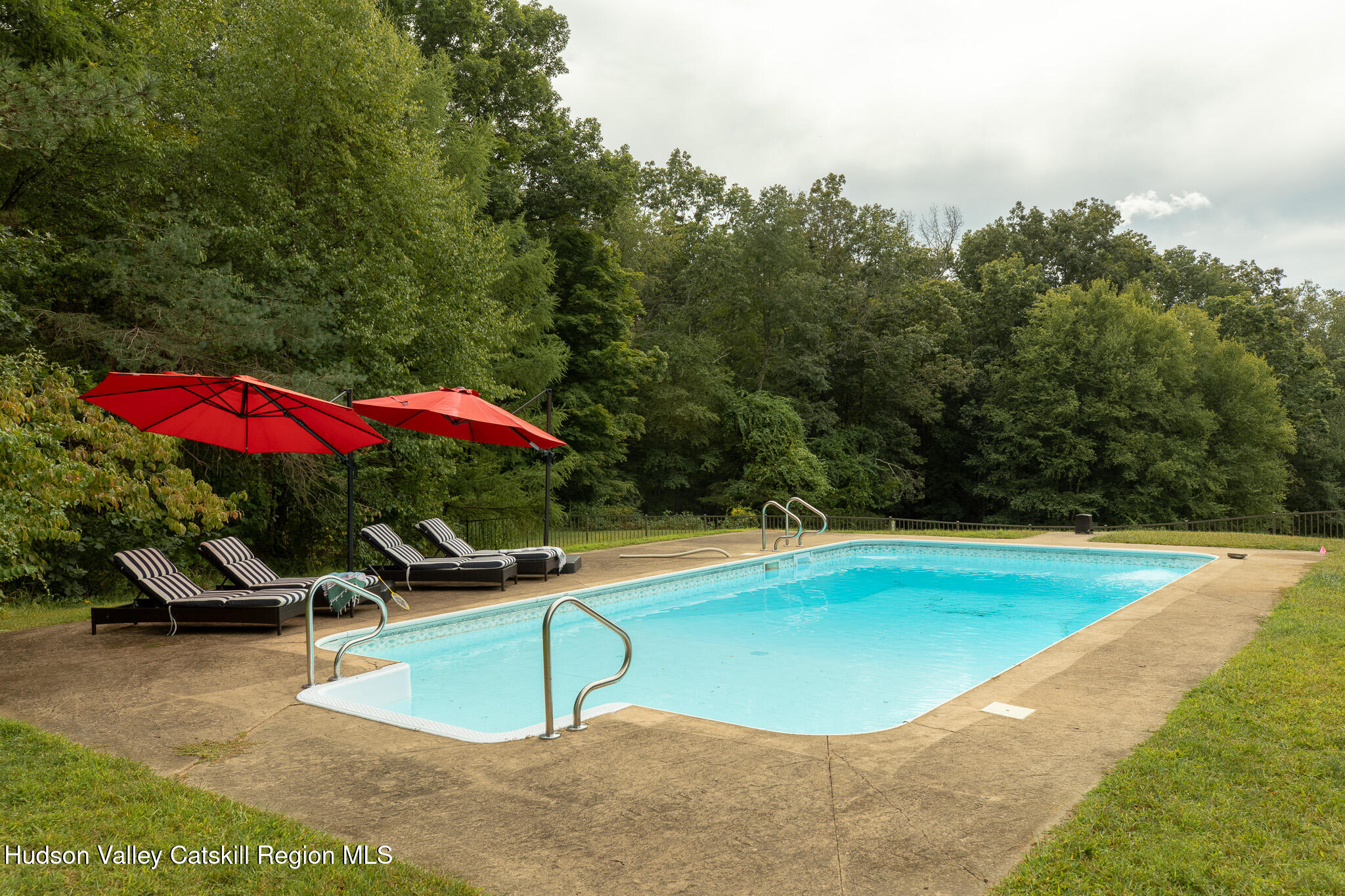 46 Webster Coon Road Red Hook, NY 12571 - Photo 5 of 27 a view of a swimming pool with a yard and sitting area