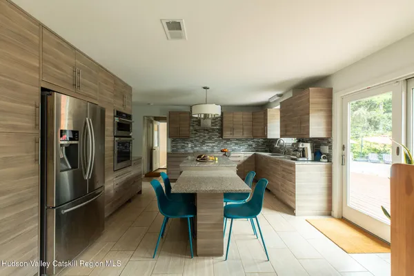 a view of a dining room with furniture window and outside view