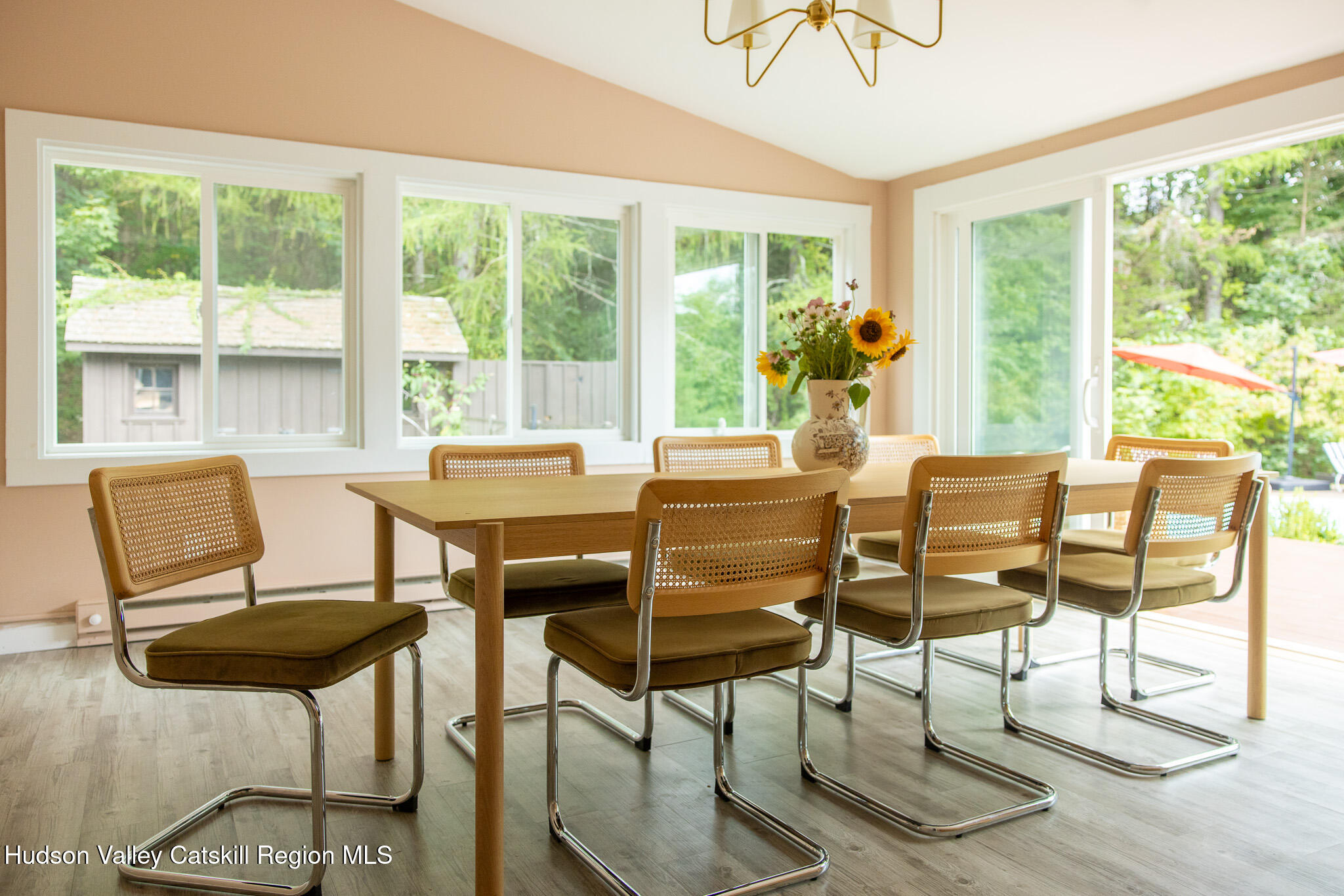 46 Webster Coon Road Red Hook, NY 12571 - Photo 10 of 27 a dining room with furniture a chandelier and wooden floor