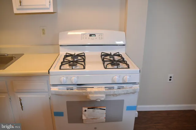 a bathroom with a sink and cabinets