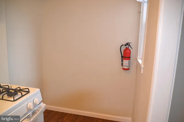 a kitchen with a sink cabinets and a stove top oven