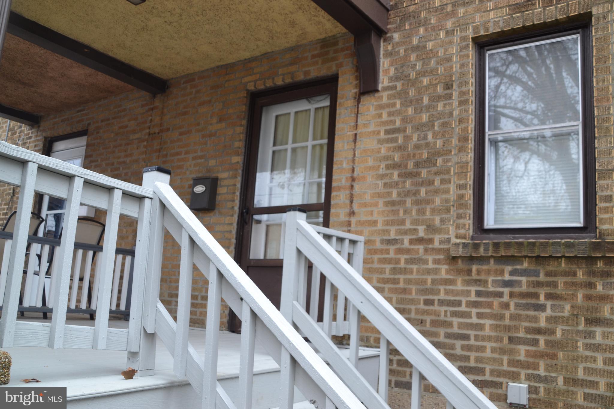 7042 Clinton Road Upper Darby, PA 19082 - Photo 2 of 33 a view of staircase with lots of windows and white walls