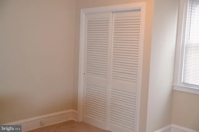 a view of a room that has a window in it