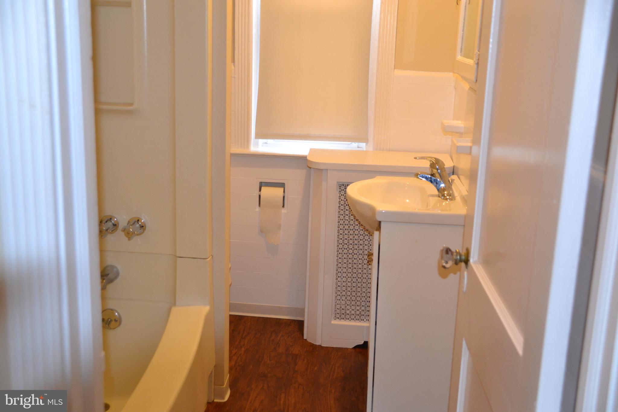 7042 Clinton Road Upper Darby, PA 19082 - Photo 27 of 33 a bathroom with a sink and a shower