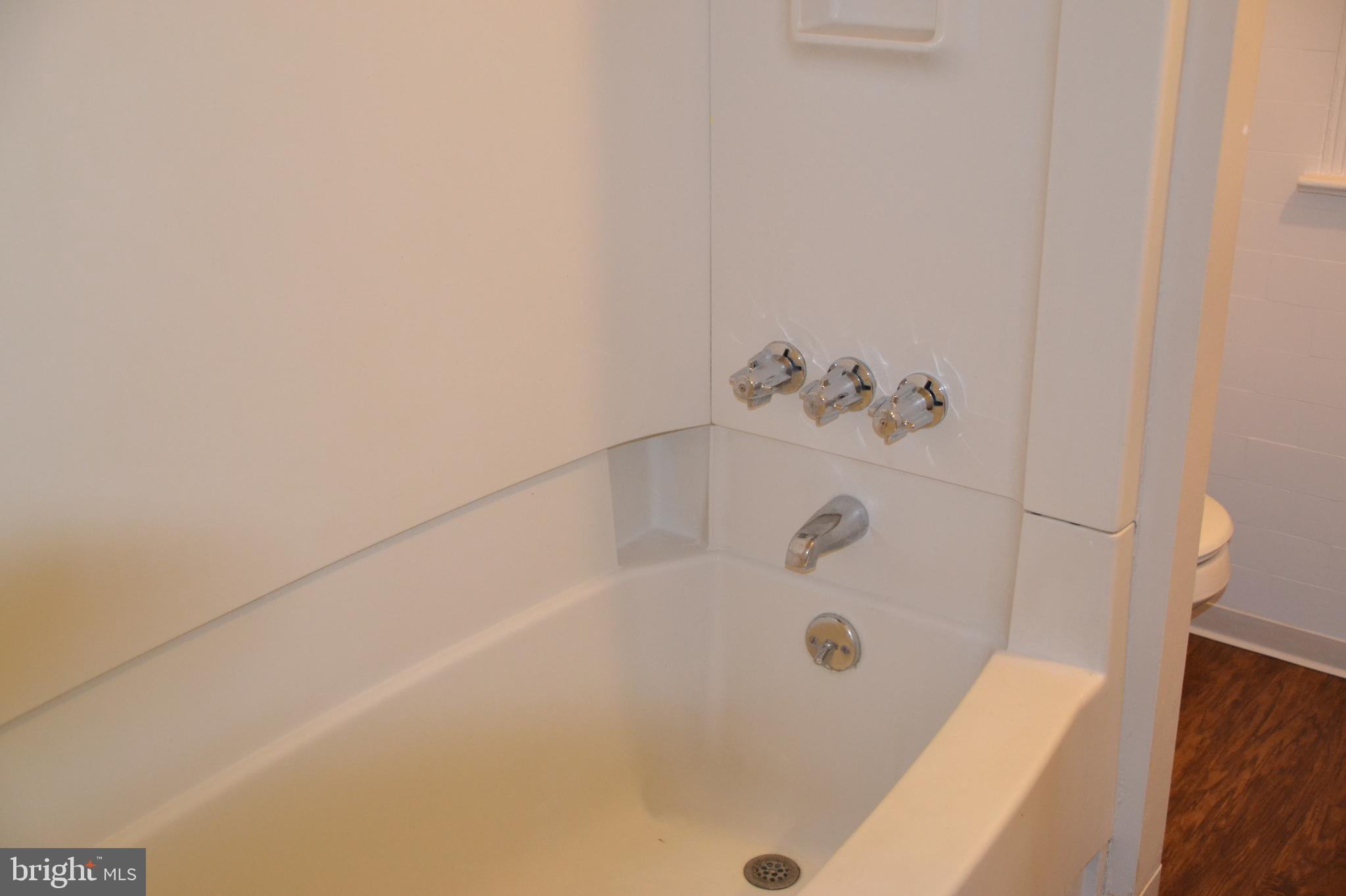 7042 Clinton Road Upper Darby, PA 19082 - Photo 28 of 33 a bathroom with a bathtub