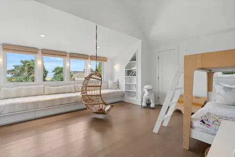 a bedroom with furniture and a window