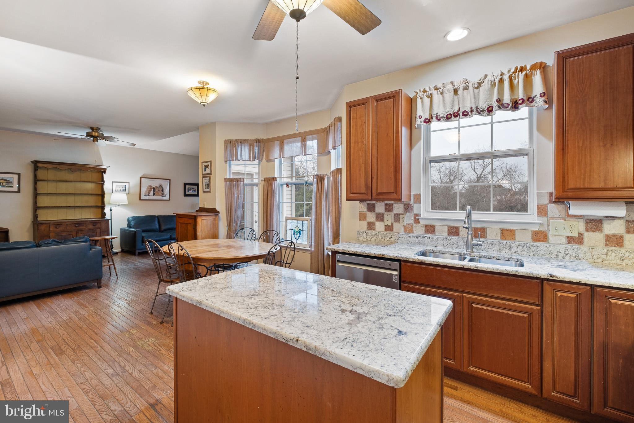 224 West Old Squaw Road Middletown, DE 19709 - Photo 16 of 43 a kitchen with sink cabinets and wooden floor