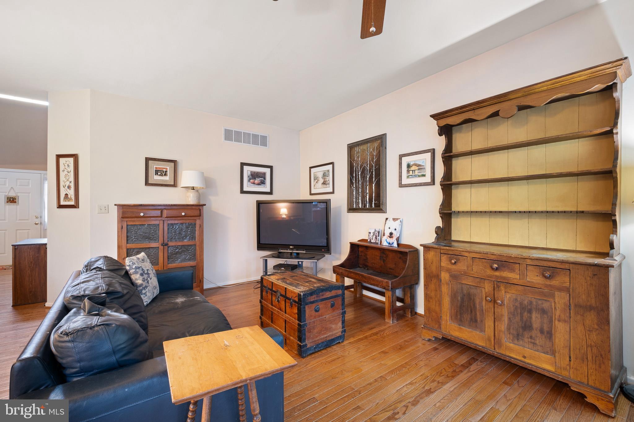 224 West Old Squaw Road Middletown, DE 19709 - Photo 19 of 43 a living room with furniture and a flat screen tv