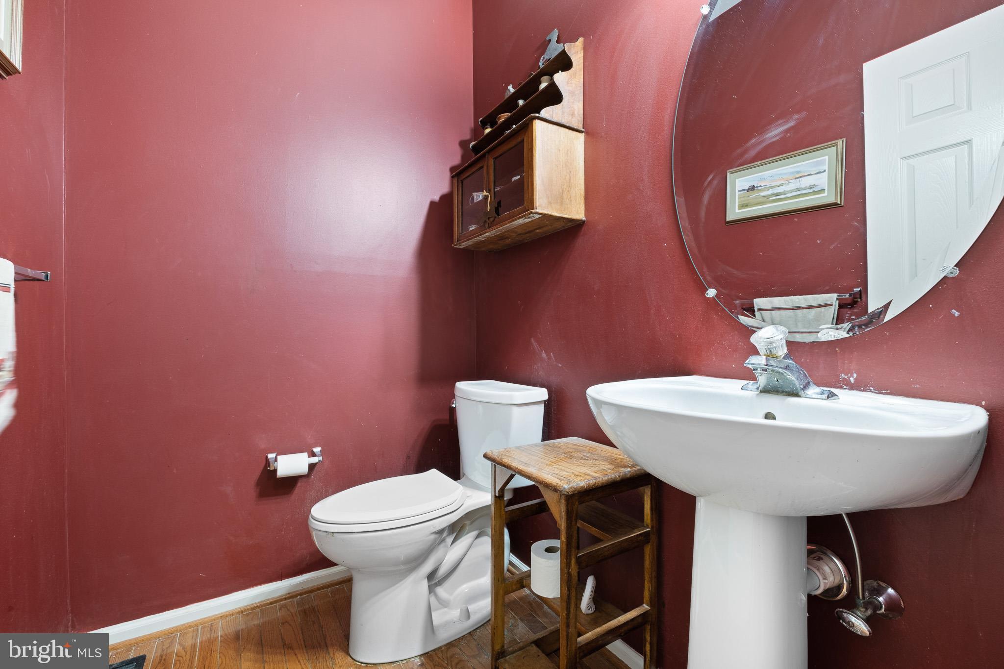 224 West Old Squaw Road Middletown, DE 19709 - Photo 29 of 43 a bathroom with a toilet a sink and mirror