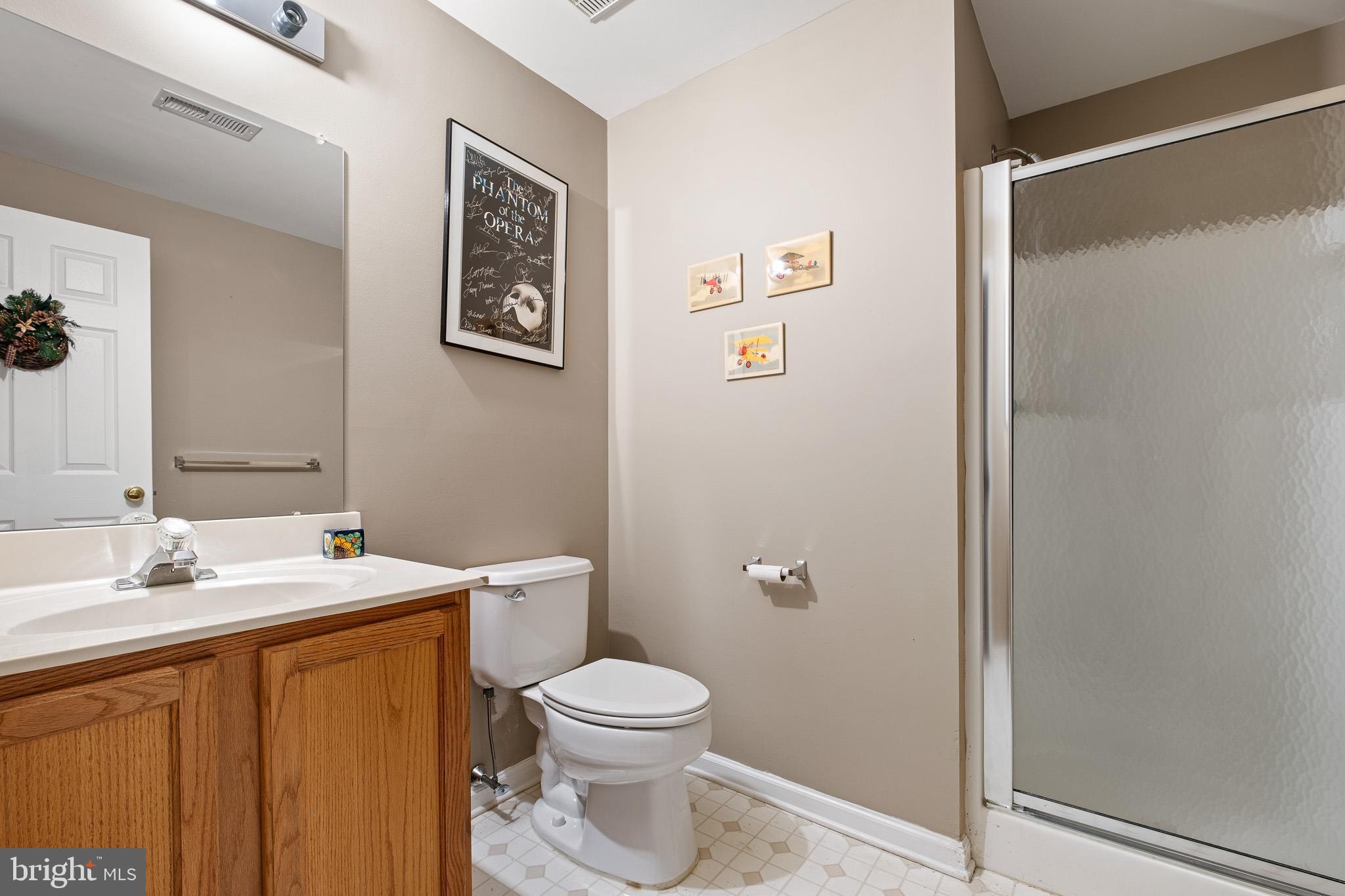 224 West Old Squaw Road Middletown, DE 19709 - Photo 43 of 43 a bathroom with a toilet sink and mirror