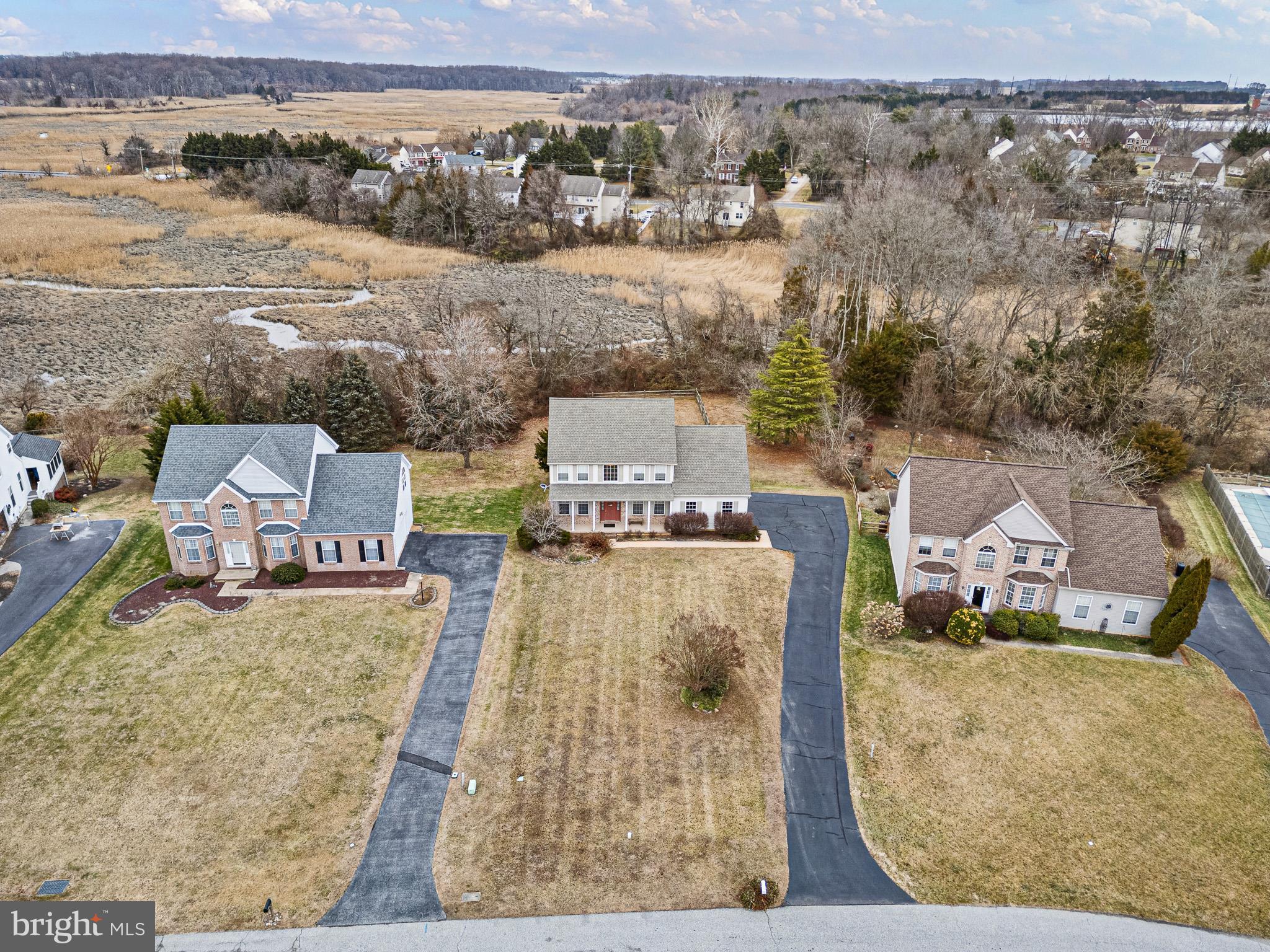224 West Old Squaw Road Middletown, DE 19709 - Photo 5 of 43 an aerial view of a house with a garden and lake view