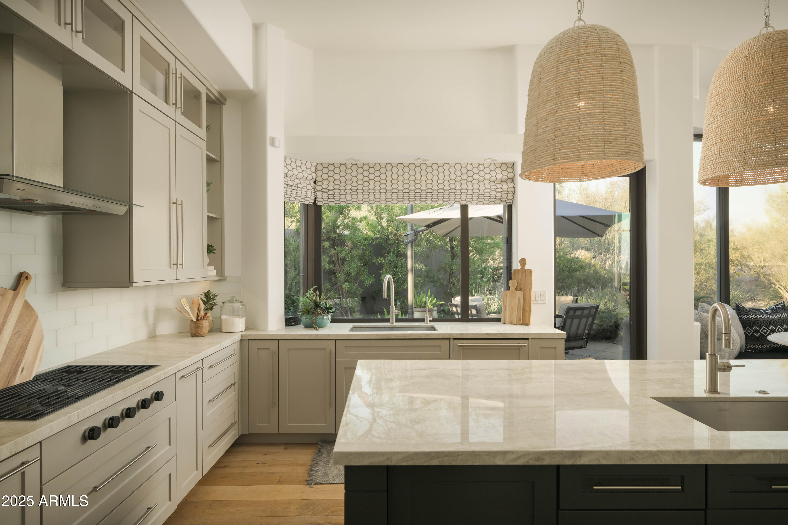 10040 East Happy Valley Road, Unit 1011 Scottsdale, AZ 85255 - Photo 12 of 27 Kitchen overlooking outdoor living