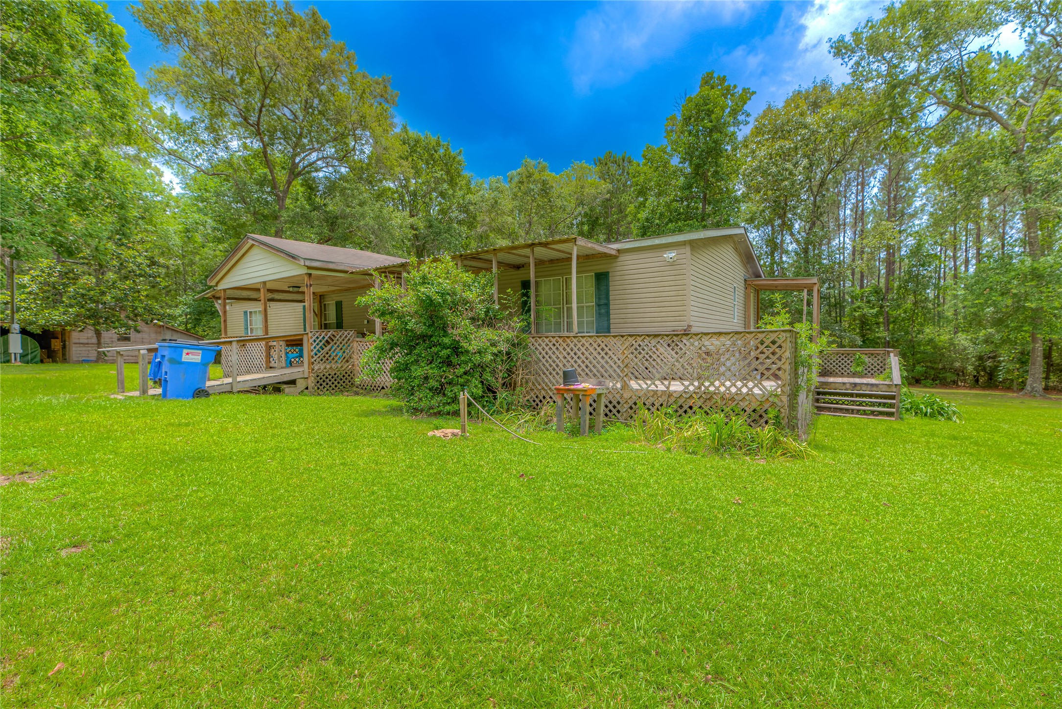657 Parrish Road Livingston, TX 77351 - Photo 23 of 47 a front view of a house with garden