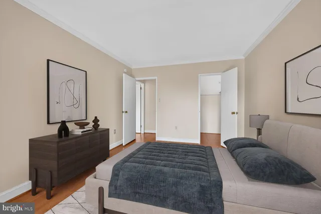 a bedroom with a bed and couch