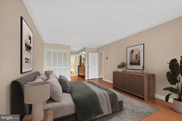 a spacious bathroom with a double vanity sink a mirror and a shower