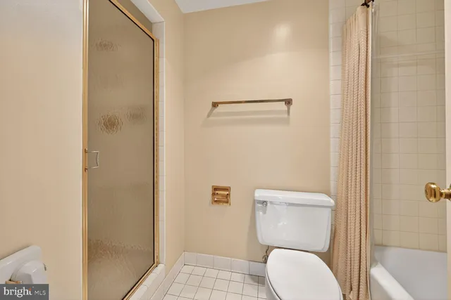 a kitchen with stainless steel appliances granite countertop a stove a sink a refrigerator dining table and chairs