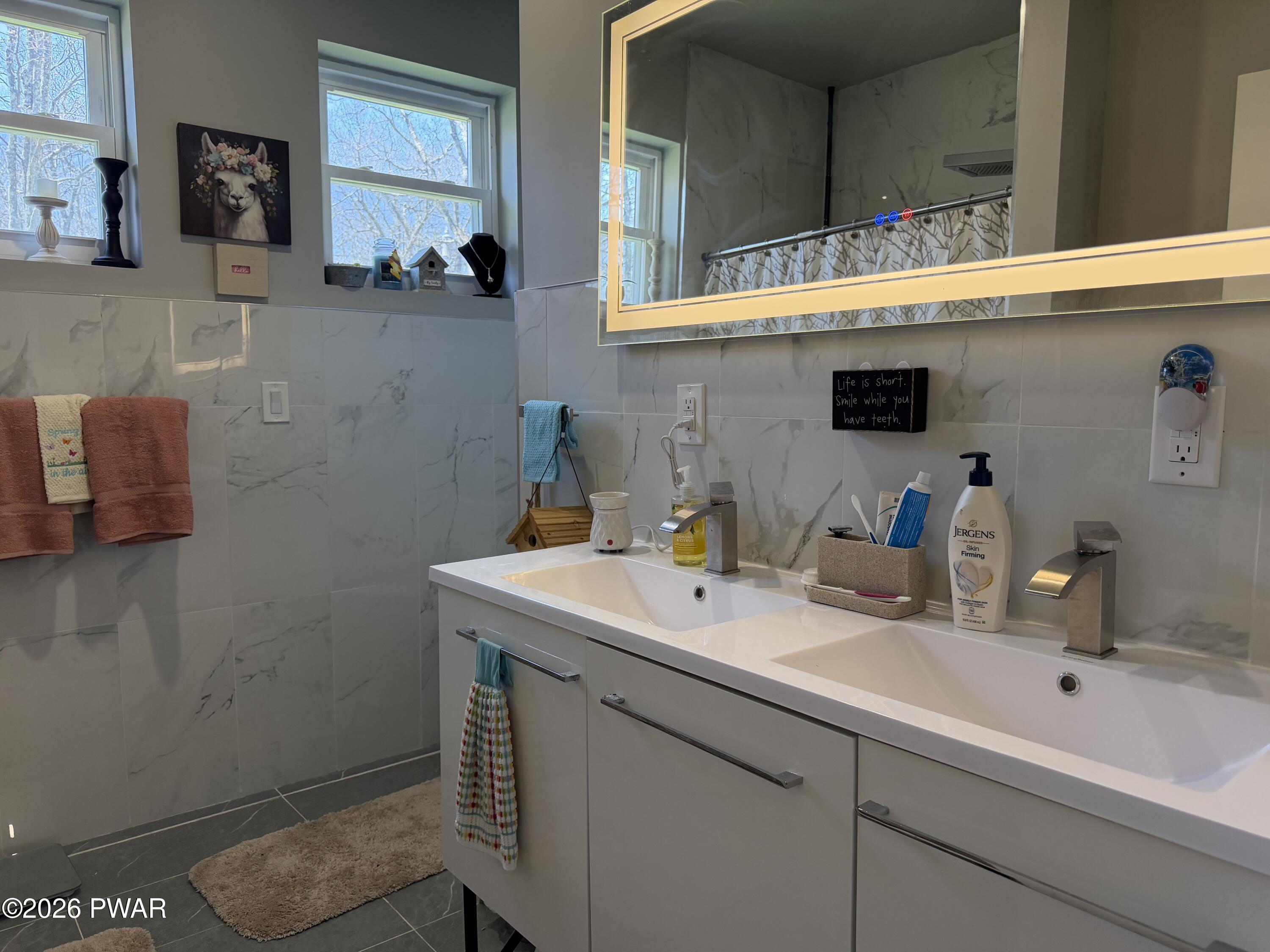 801 Maple Ridge Court Hawley, PA 18428 - Photo 24 of 55 a bathroom with a sink and a mirror