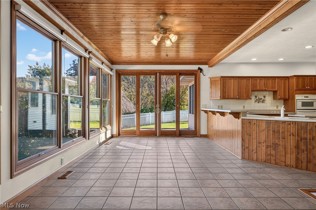 6615 Shilling Road Geneva, OH 44041 - Photo 14 of 49 Ceramic tiled breakfast area/dining space with access to the patio and the sunroom