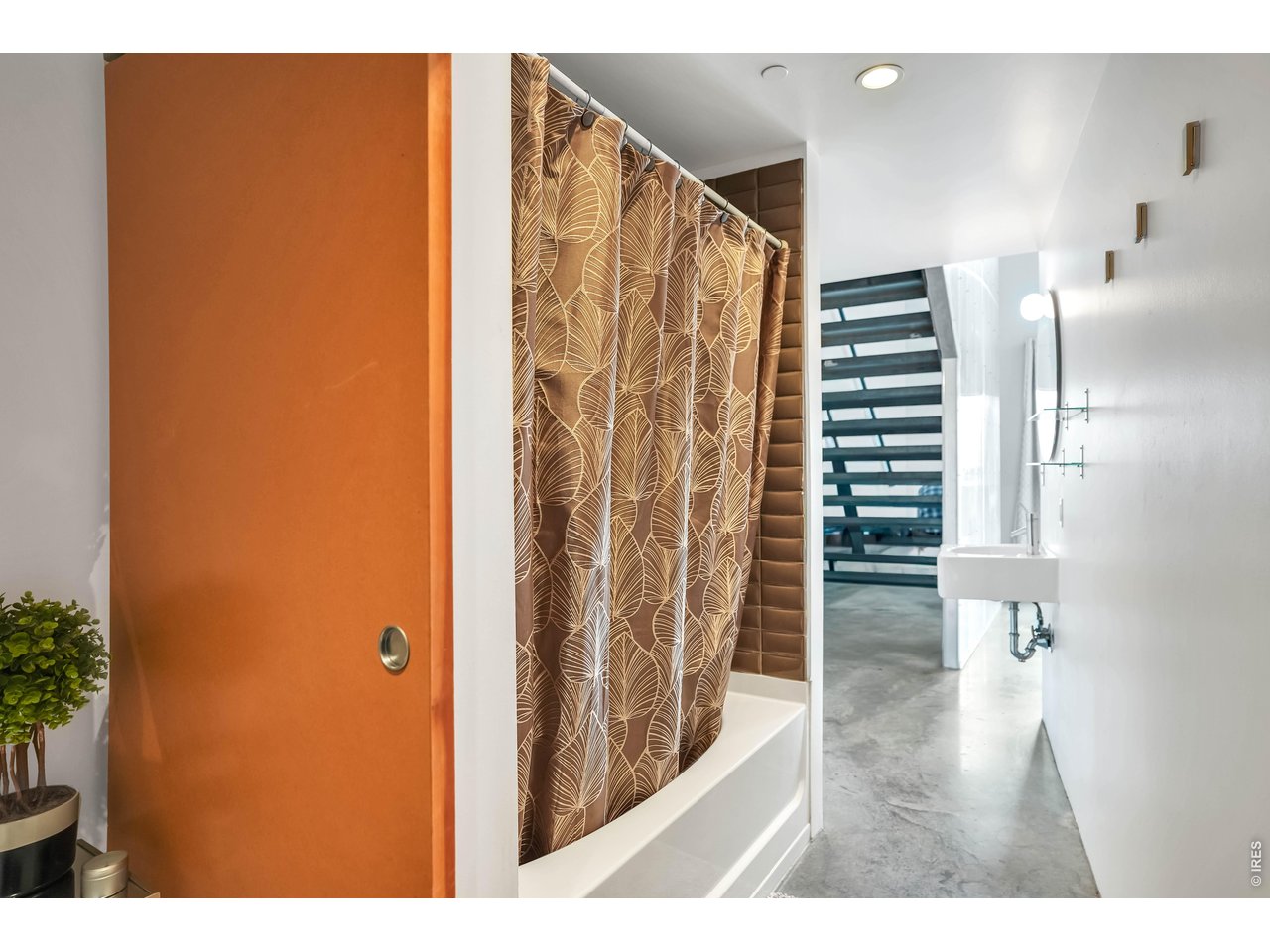 3457 Ringsby Court, Unit 327 Denver, CO 80216 - Photo 16 of 29 a view of entryway with wooden floor