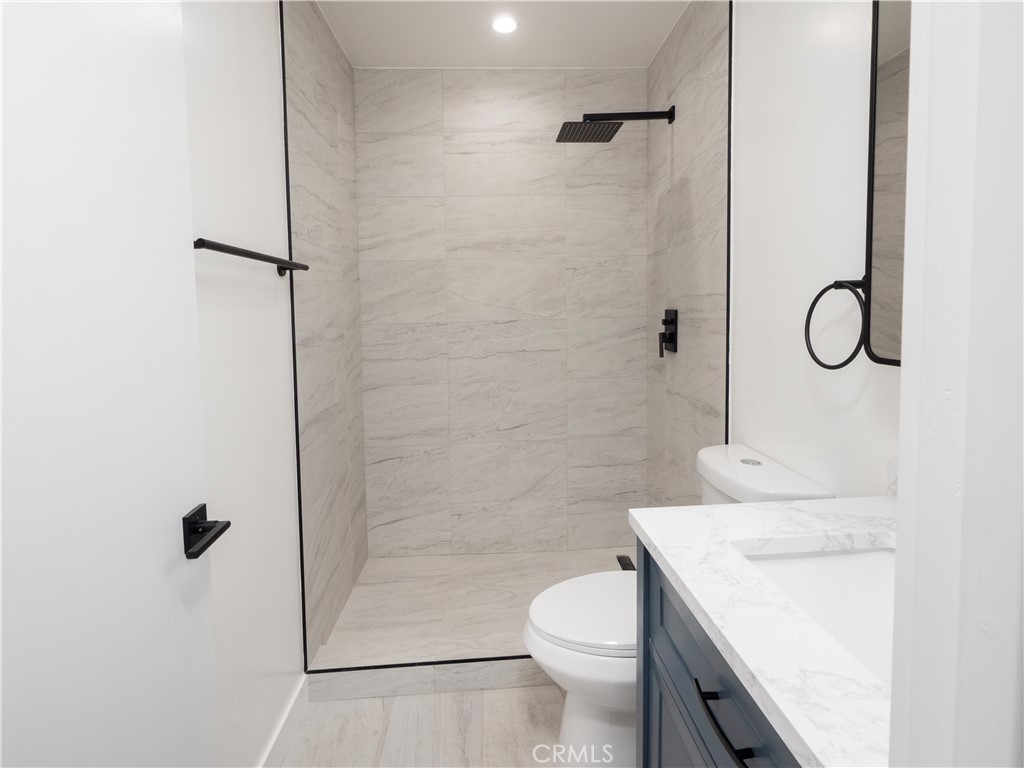 1571 Ricardo Street, Unit 2 Los Angeles, CA 90033 - Photo 8 of 29 a bathroom with a sink a toilet and shower