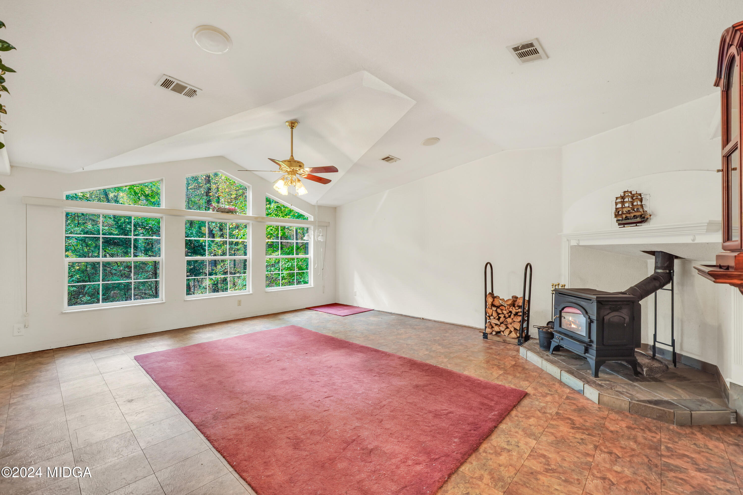 615 Fuller Road Culloden, GA 31016 - Photo 13 of 37 a view of an empty room with a window and a kitchen