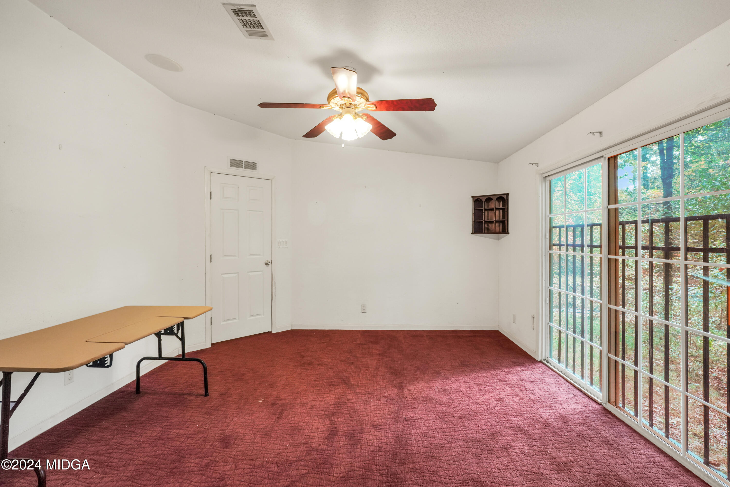 615 Fuller Road Culloden, GA 31016 - Photo 17 of 37 wooden floor in an empty room with a window