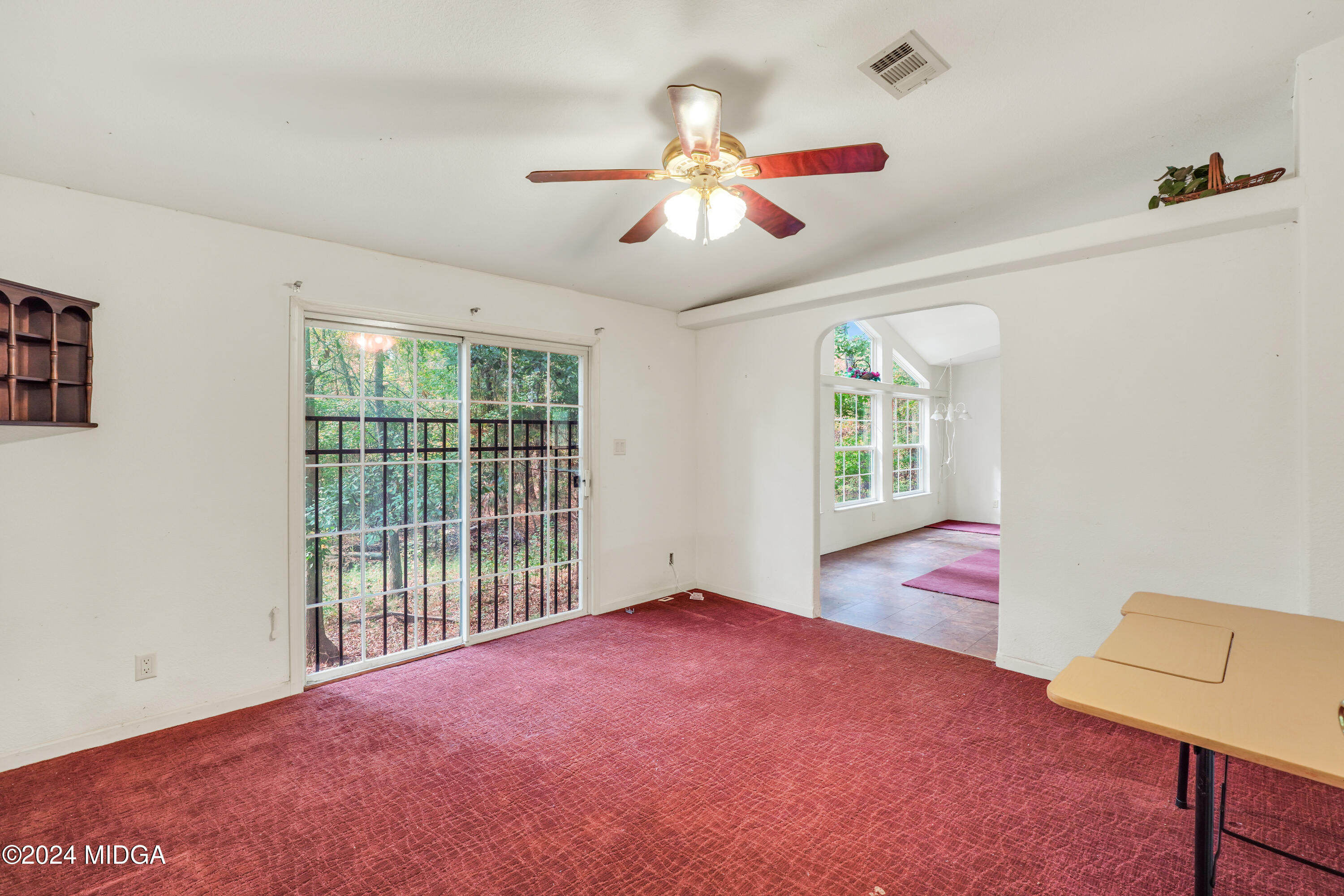 615 Fuller Road Culloden, GA 31016 - Photo 18 of 37 a bedroom with furniture and a large window