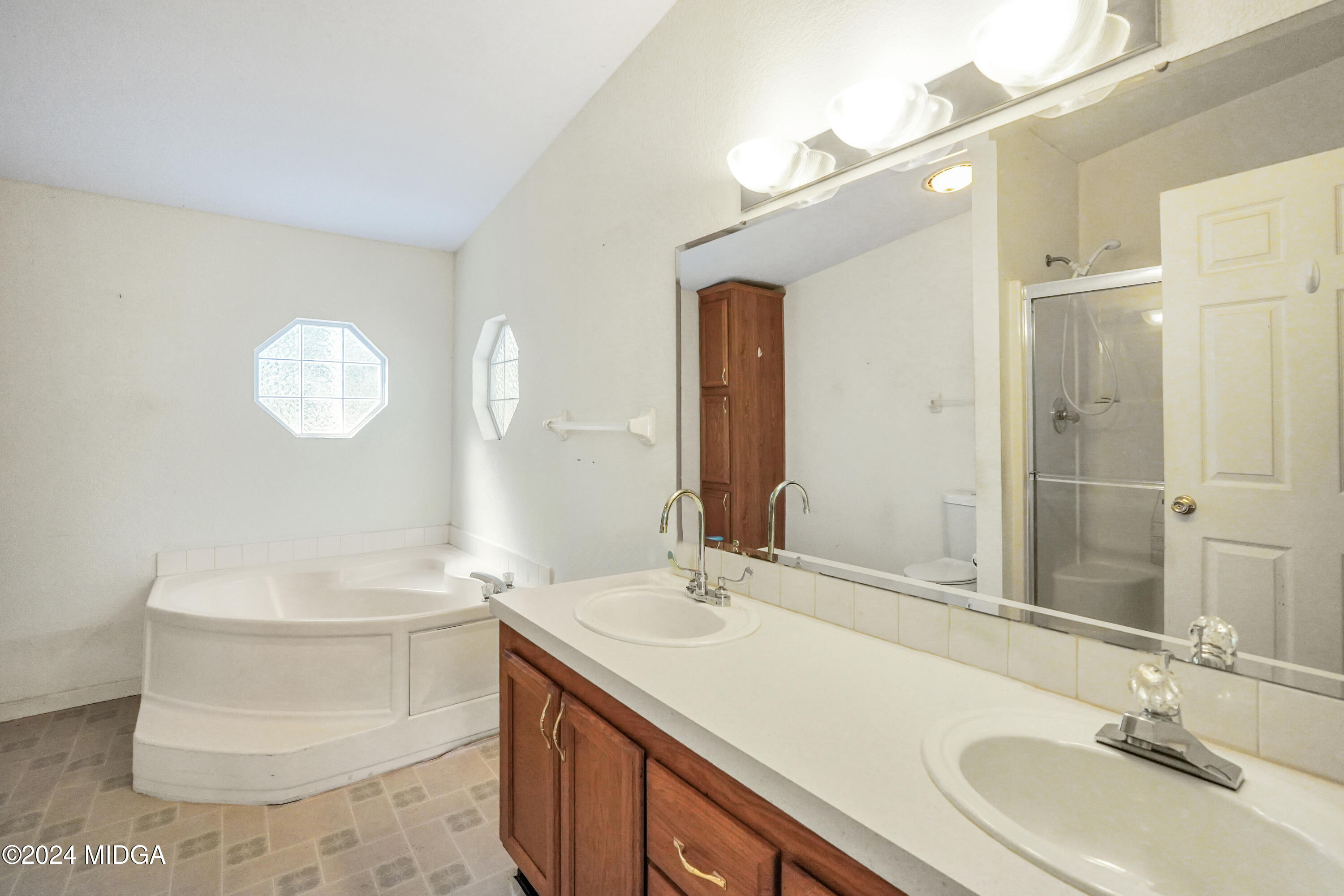 615 Fuller Road Culloden, GA 31016 - Photo 20 of 37 a bathroom with a double vanity sink mirror and toilet