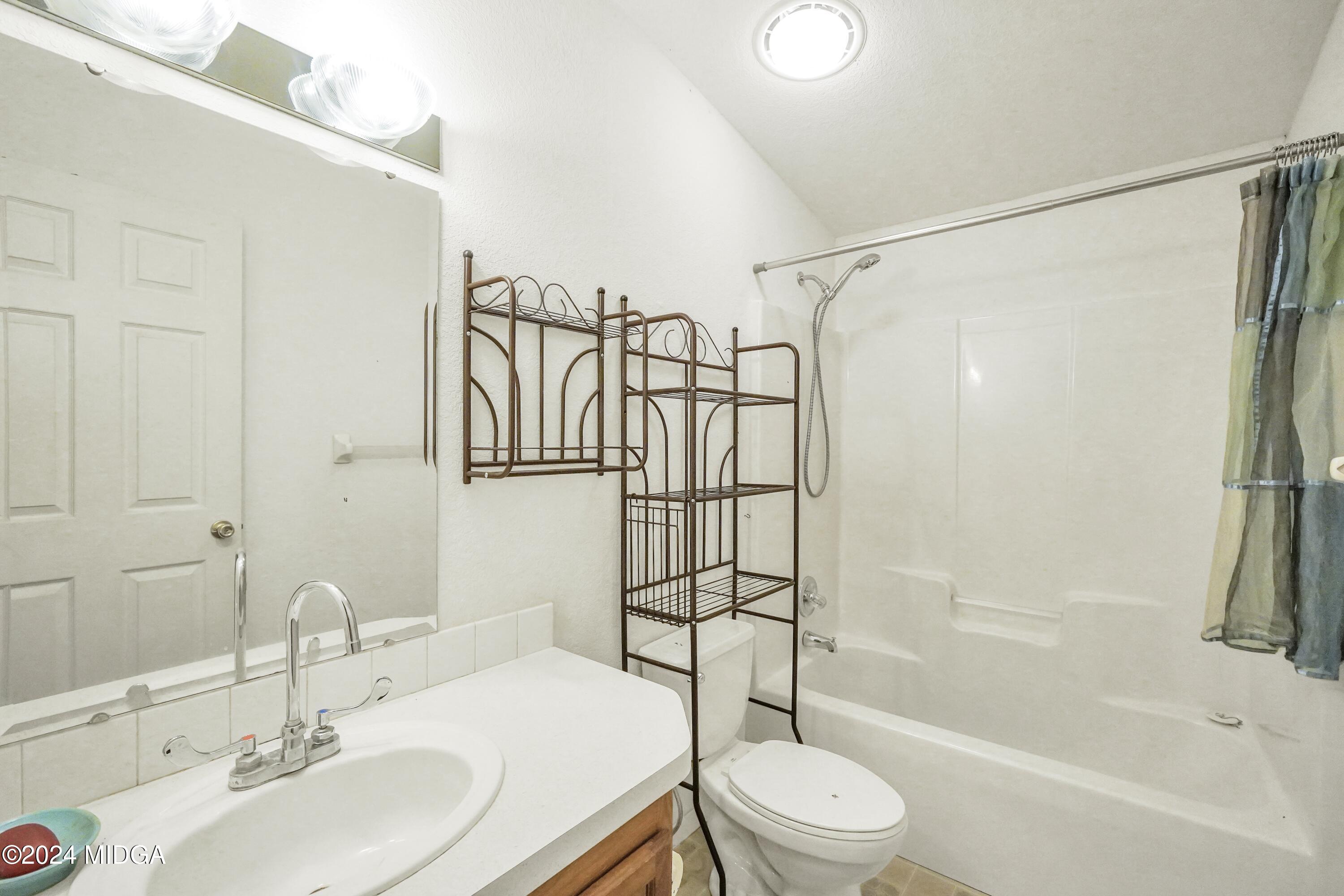 615 Fuller Road Culloden, GA 31016 - Photo 24 of 37 a bathroom with a sink toilet and shower