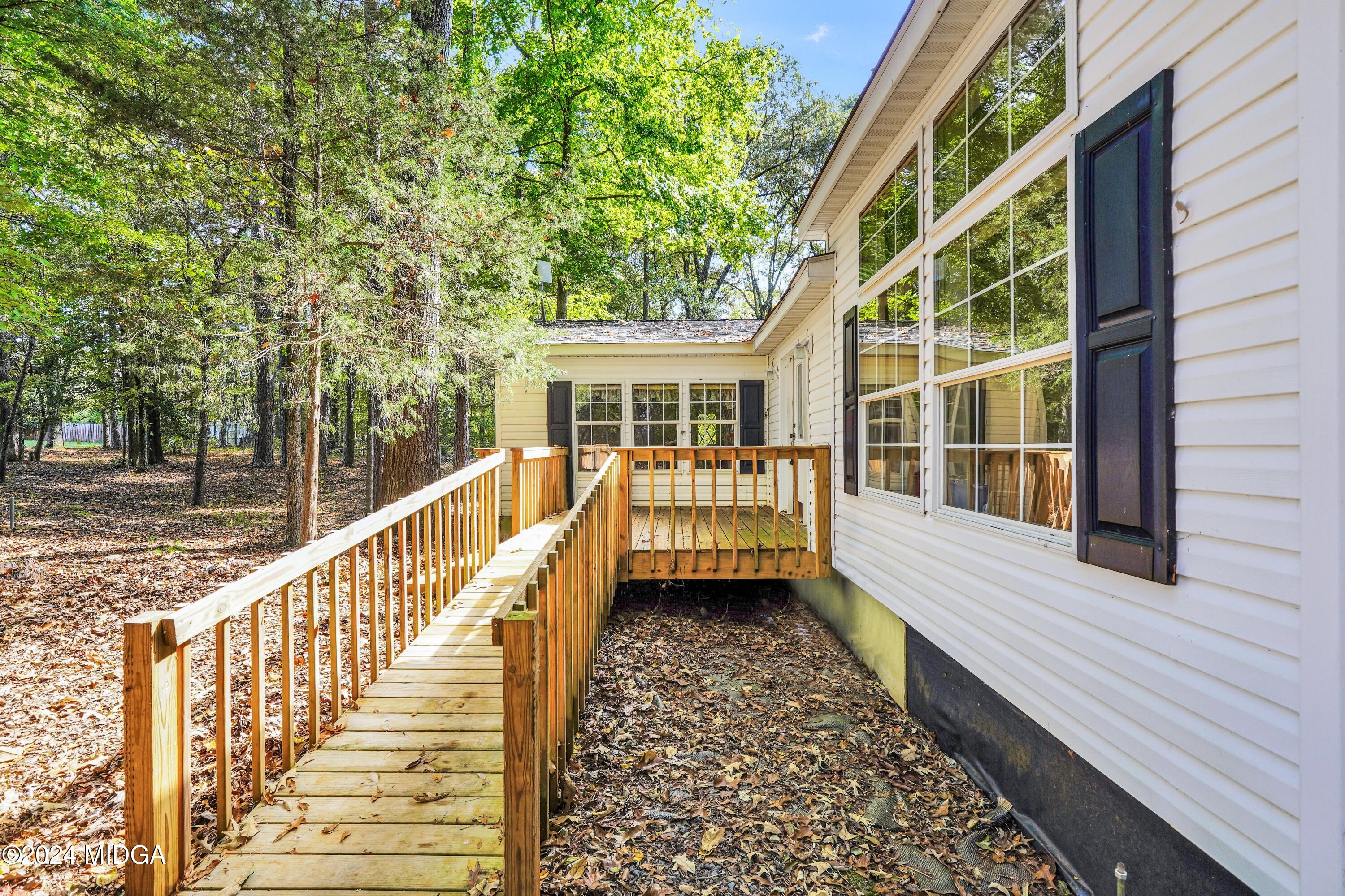 615 Fuller Road Culloden, GA 31016 - Photo 30 of 37 a view of a house with wooden deck