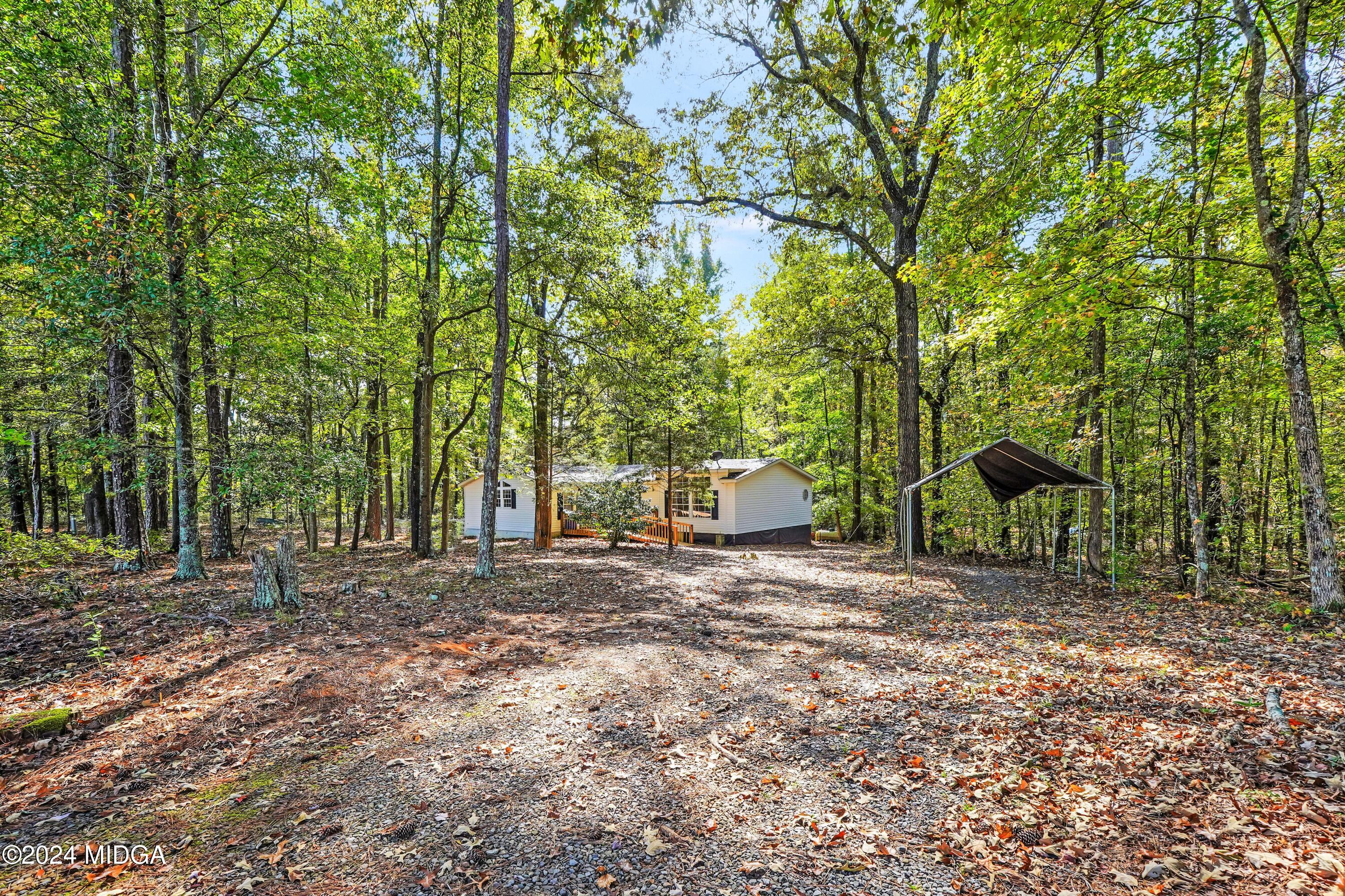 615 Fuller Road Culloden, GA 31016 - Photo 31 of 37 a view of a outdoor space with large trees