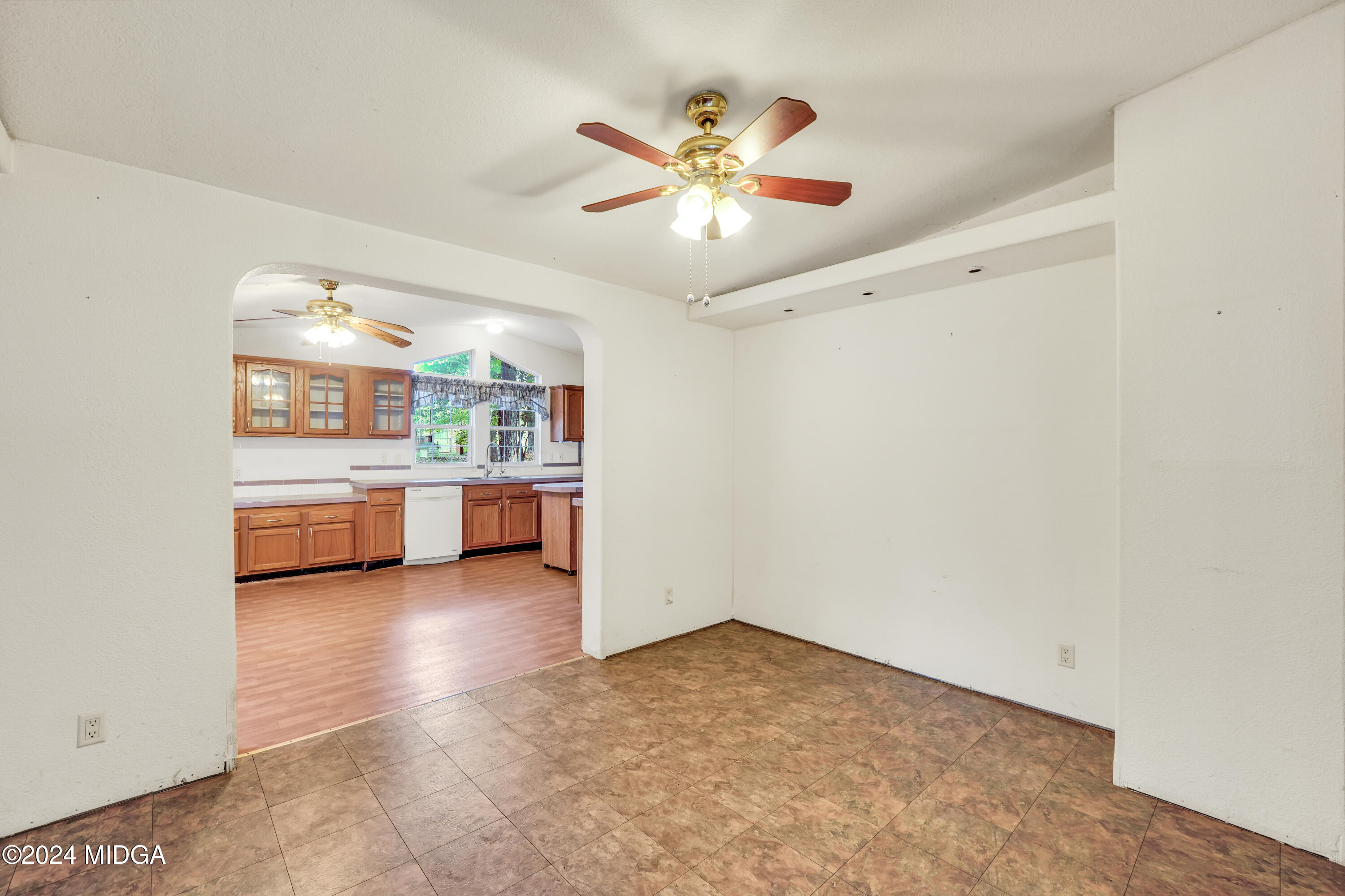615 Fuller Road Culloden, GA 31016 - Photo 6 of 37 a view of a kitchen with a sink a ceiling fan and kitchen view