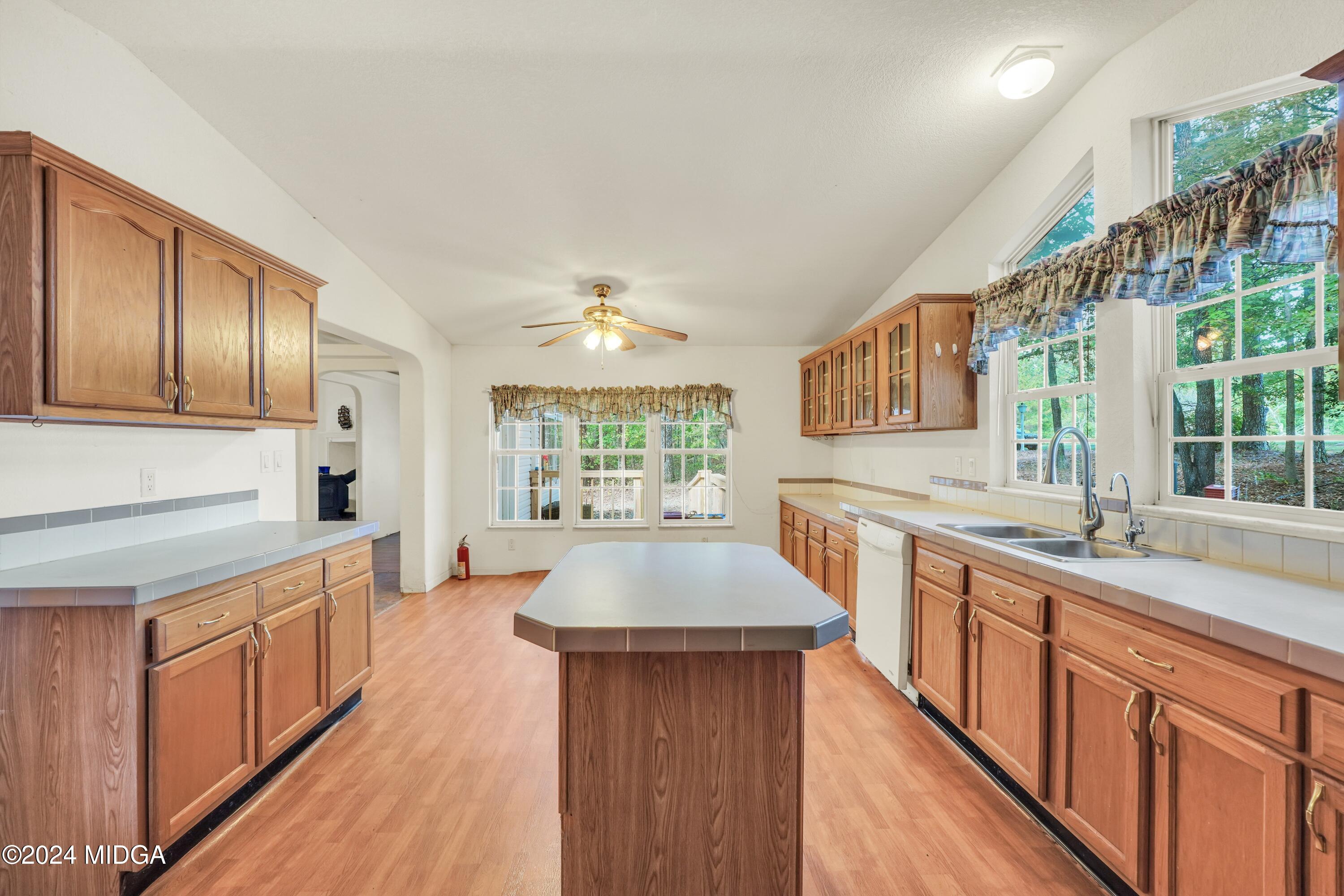 615 Fuller Road Culloden, GA 31016 - Photo 8 of 37 a kitchen with stainless steel appliances granite countertop a sink stove and refrigerator