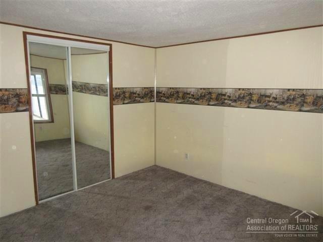 8883 Southwest Sand Ridge Road Terrebonne, OR 97760 - Photo 9 of 17 Guest bedroom is at the opposite side of