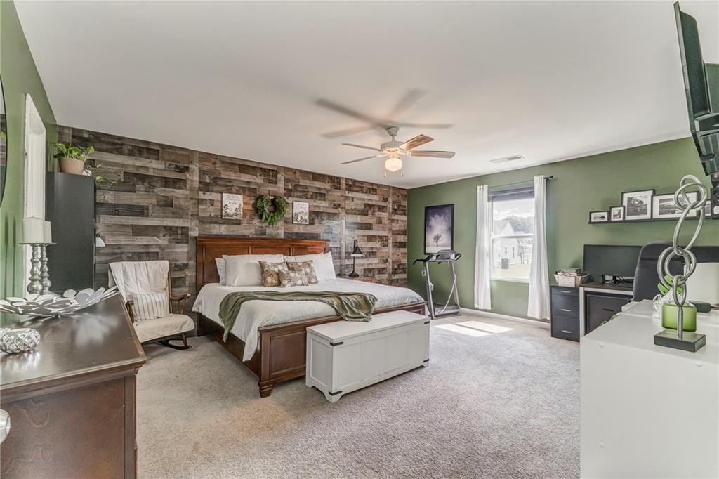 803 Riverside Drive Calhoun, GA 30701 - Photo 27 of 63 a spacious bedroom with a bed and furniture