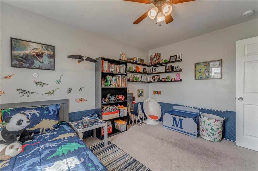 803 Riverside Drive Calhoun, GA 30701 - Photo 43 of 63 a bedroom with furniture and a chandelier