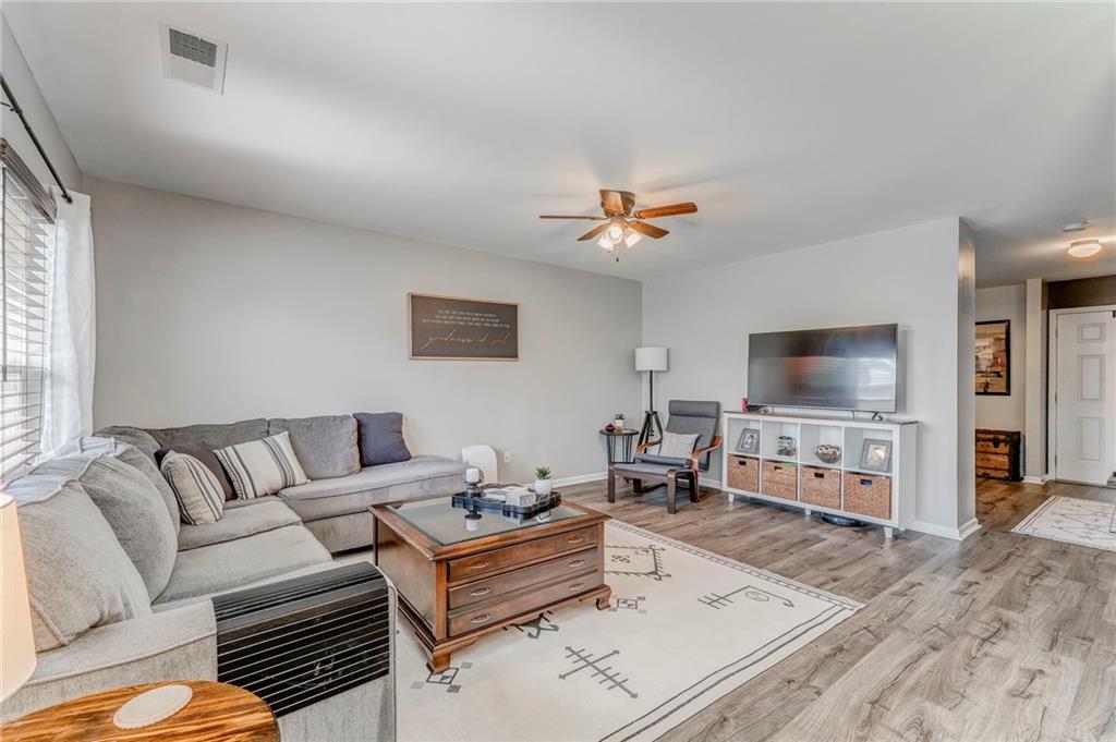 803 Riverside Drive Calhoun, GA 30701 - Photo 8 of 63 a living room with furniture and a flat screen tv
