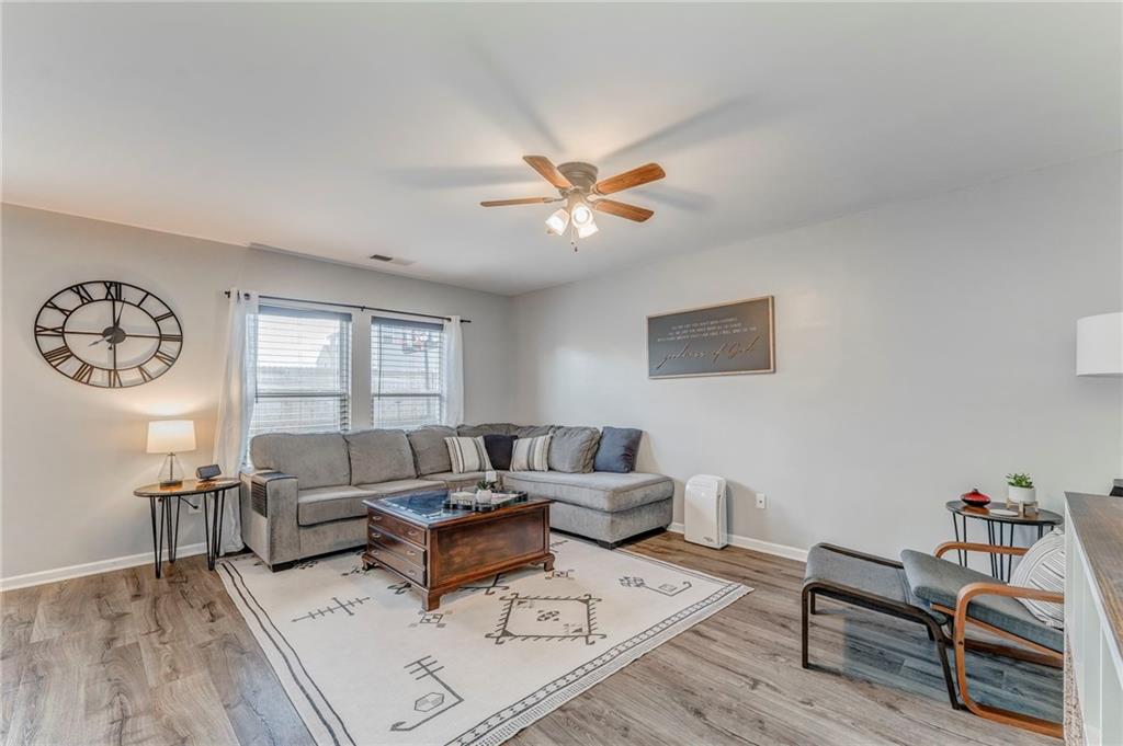 803 Riverside Drive Calhoun, GA 30701 - Photo 10 of 63 a living room with furniture a rug and a window