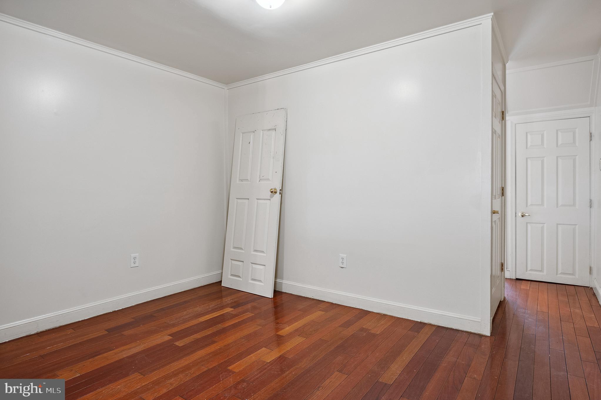 636 South Monroe Street Baltimore, MD 21223 - Photo 11 of 39 a view of an empty room with wooden floor