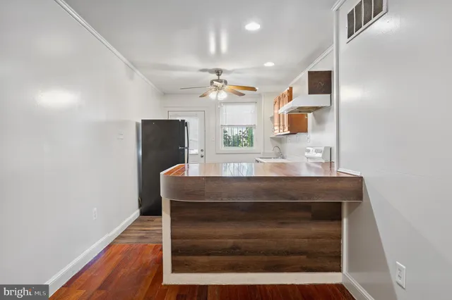 a bathroom with a sink a vanity and mirror