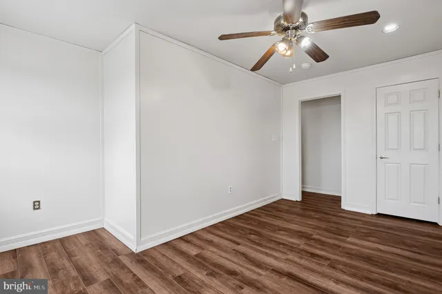 a view of a room with wooden floor