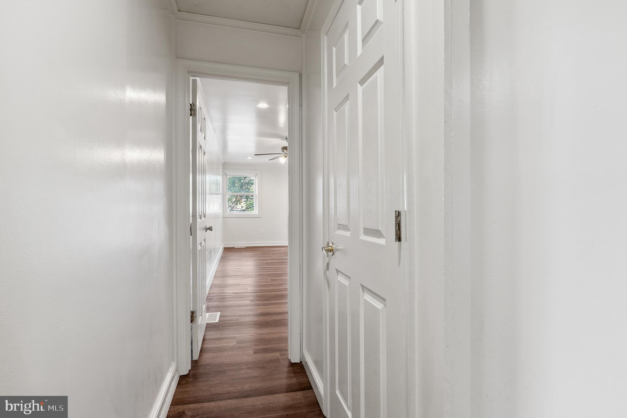 636 South Monroe Street Baltimore, MD 21223 - Photo 23 of 39 a view of a hallway with a wooden door