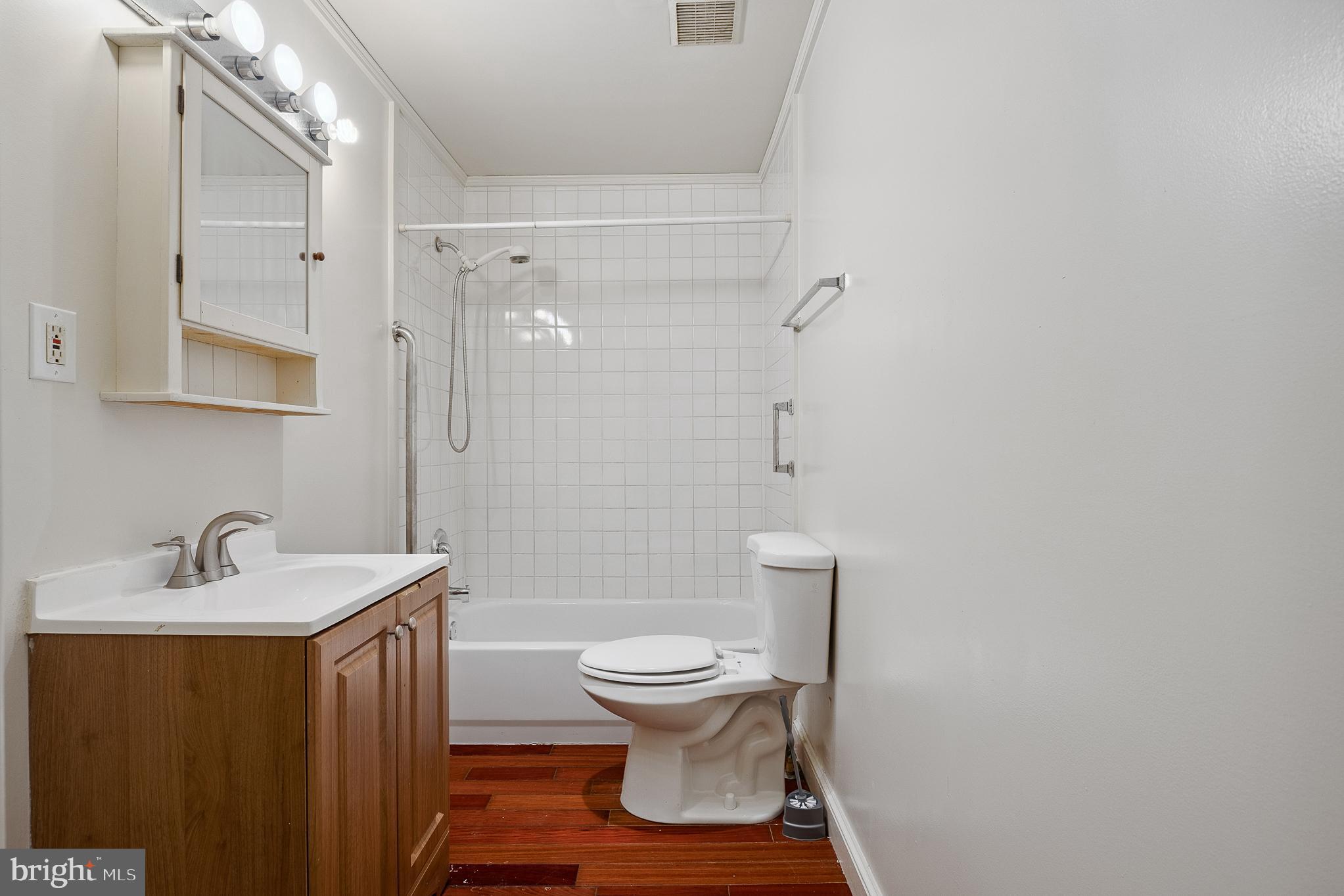 636 South Monroe Street Baltimore, MD 21223 - Photo 24 of 39 a bathroom with a sink a toilet and shower