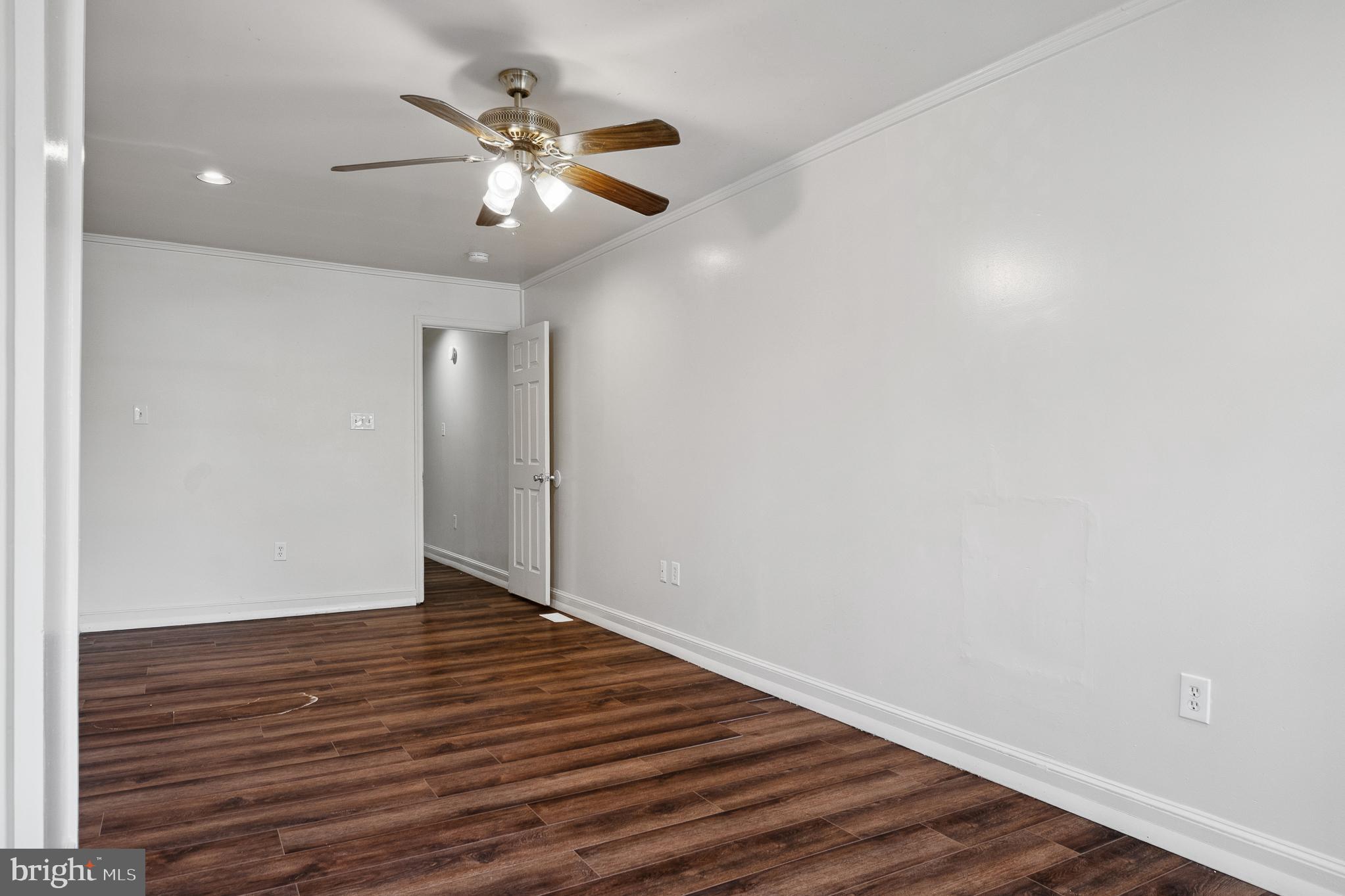 636 South Monroe Street Baltimore, MD 21223 - Photo 30 of 39 a view of an empty room with wooden floor