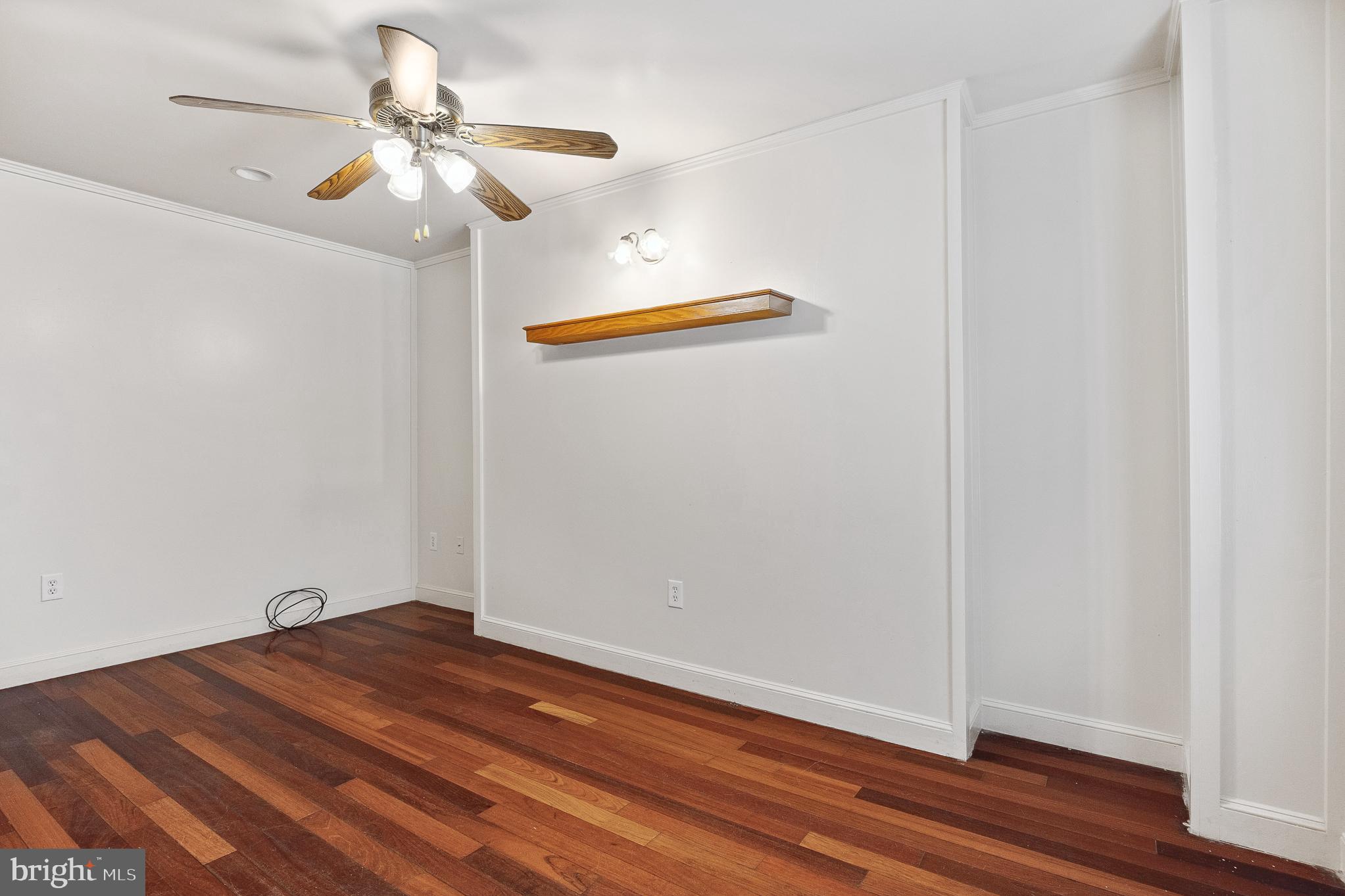 636 South Monroe Street Baltimore, MD 21223 - Photo 4 of 39 wooden floor in an empty room