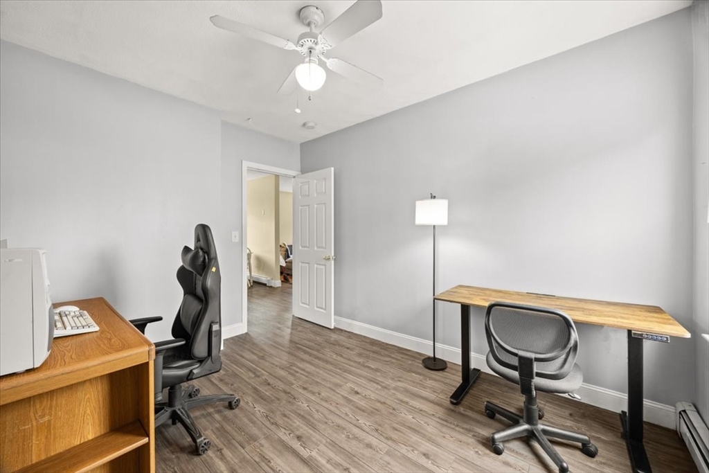 35 Hazel Street, Unit B Attleboro, MA 02703 - Photo 14 of 21 a view of a workspace with furniture and a gym equipment
