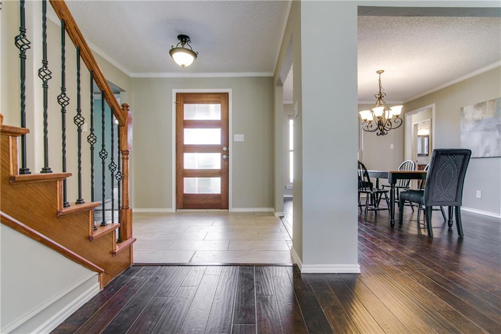 3427 Waterview Trail Rockwall, TX 75087 - Photo 1 of 1 a view of a dining room with furniture window and wooden floor