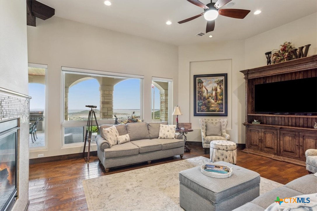 3319 Eagle Ridge Drive Harker Heights, TX 76548 - Photo 11 of 48 a living room with furniture a flat screen tv and a fireplace